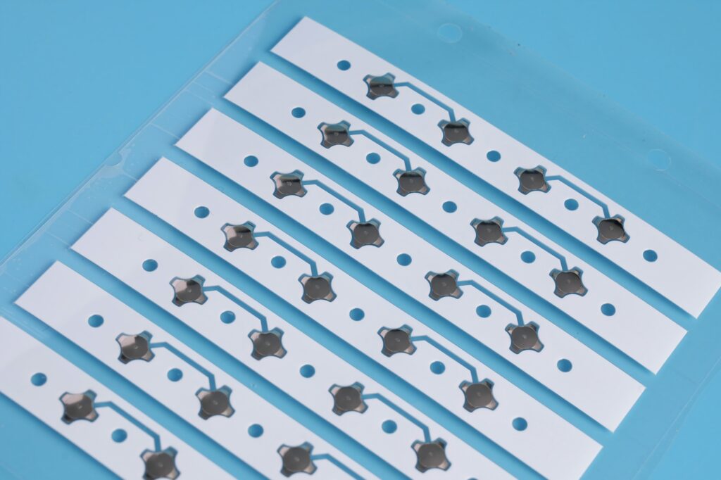 Metal dome array for automotive electronics, Metal dome array