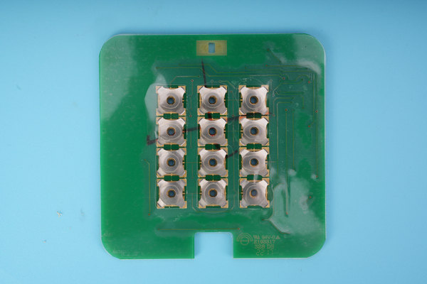 Real PCB-mounted metal dome array used as an installation inspection reference