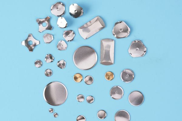 Several real loose metal dome shapes used as a format reference